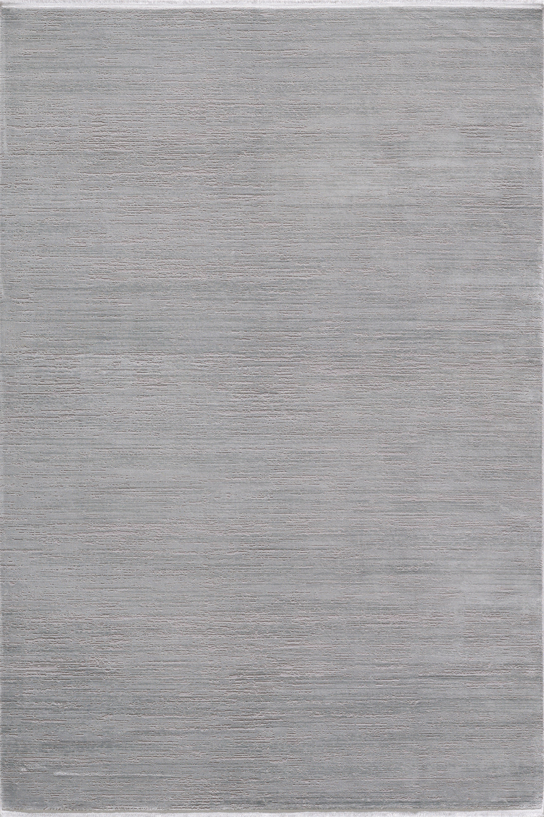 The Silver Lining Grey Rug - M352I is a large, rectangular light gray minimalist rug with a subtle textured pattern and smooth surface.