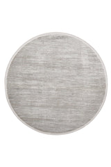 The Silver Lining Grey Rug - M352I is a round, light gray minimalist rug with a subtle textured pattern, thin border, and flat pile design, shown on a white background.