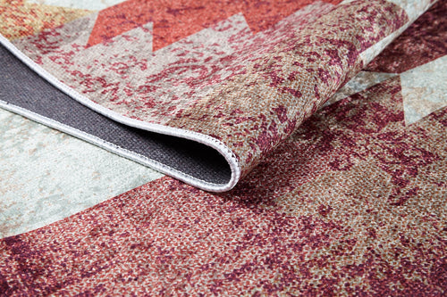 Load image 1 in gallery view. A close-up of the Simplistic Artistry - Washable Rug - JR1647 (Custom Size) reveals its red, beige, and gray pattern with one corner lifted to show the texture, thickness, and washable underside—perfect for high-traffic areas.