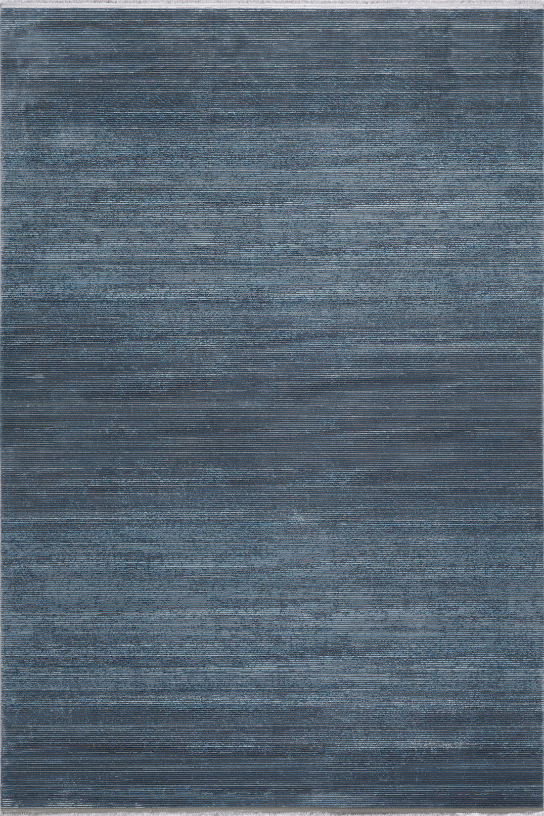 The Slate to Midnight Navy Rug - M497M is a large rectangular modern rug with a textured, painterly pattern in blue and gray shades, creating a subtle gradient effect.
