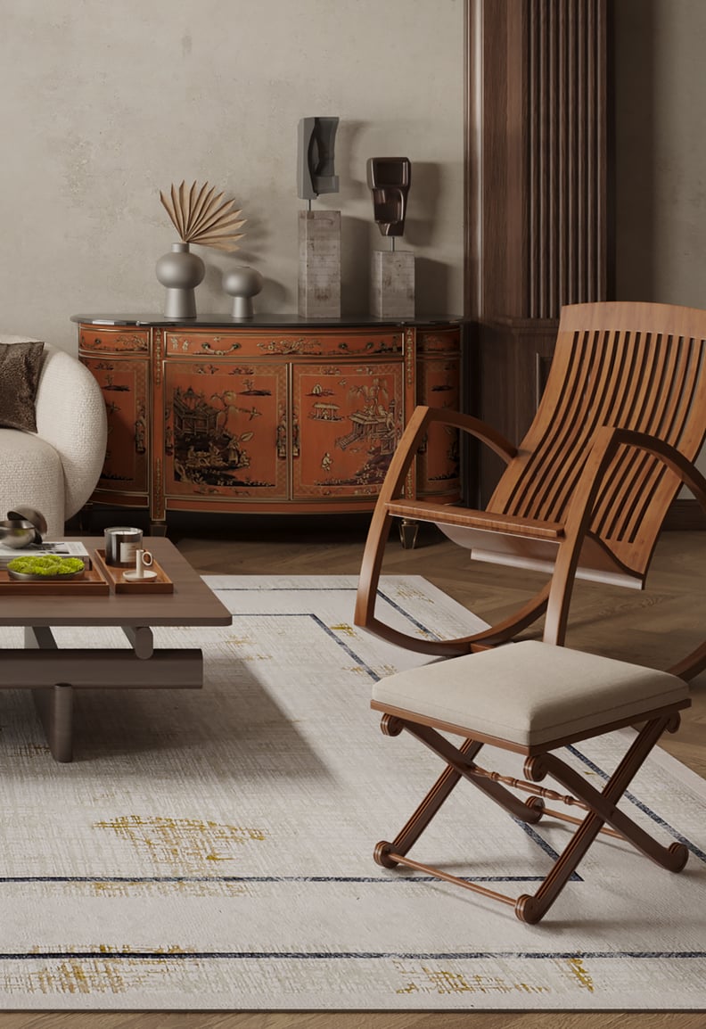 A modern living room features a beige sofa, wooden chairs, a low coffee table, and the Sleek and Contemporary - Washable Rug - JR1365 (Outlet) US in cream and beige hues, paired with an ornate red Asian-inspired sideboard.