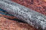 A close-up of the Soft Brushed - Washable Rug - JR5056 (Custom Size), showcasing its mottled black-and-white texture atop a reddish-brown and blue speckled surface—perfect for high-traffic areas.