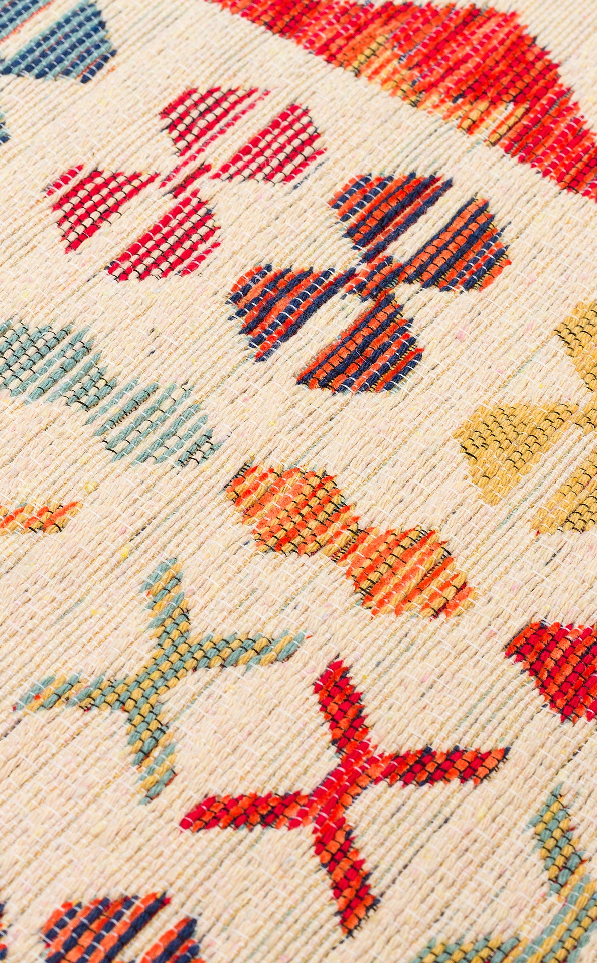 Close-up of Soft Mosaic - Kilim - NMD08 rug with a cream background, showcasing traditional geometric motifs in red, blue, yellow, and orange arranged in a repeating multicolour pattern.