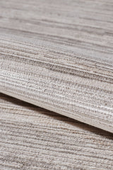 A close-up of the Soft Stripe Serenade Modern Rug - EW2814 highlights its machine-made quality, soft woven texture, and stylish light beige and grey horizontal stripes for a modern, elegant look in neutral tones.