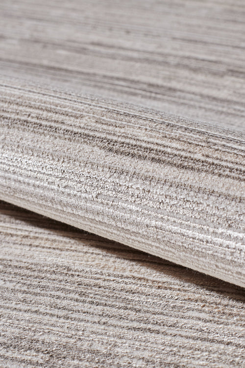 Load image 1 in gallery view. A close-up of the Soft Stripe Serenade Modern Rug - EW2814 highlights its machine-made quality, soft woven texture, and stylish light beige and grey horizontal stripes for a modern, elegant look in neutral tones.
