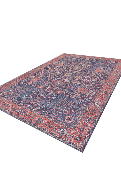 Bild 1 in Galerieansicht laden. The Solstice Red Navy Washable Rug (LCC3026) is a large rectangular Persian-style blue rug with intricate red and orange patterns, a detailed central medallion, ornate borders, and is ideal for allergy-sensitive homes.