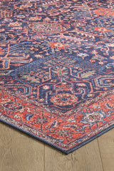 The Solstice Red Navy Washable Rug - LCC3026 (Custom Size) features intricate geometric and floral patterns in blue, red, and orange with detailed borders—durable and ideal for high-traffic areas.