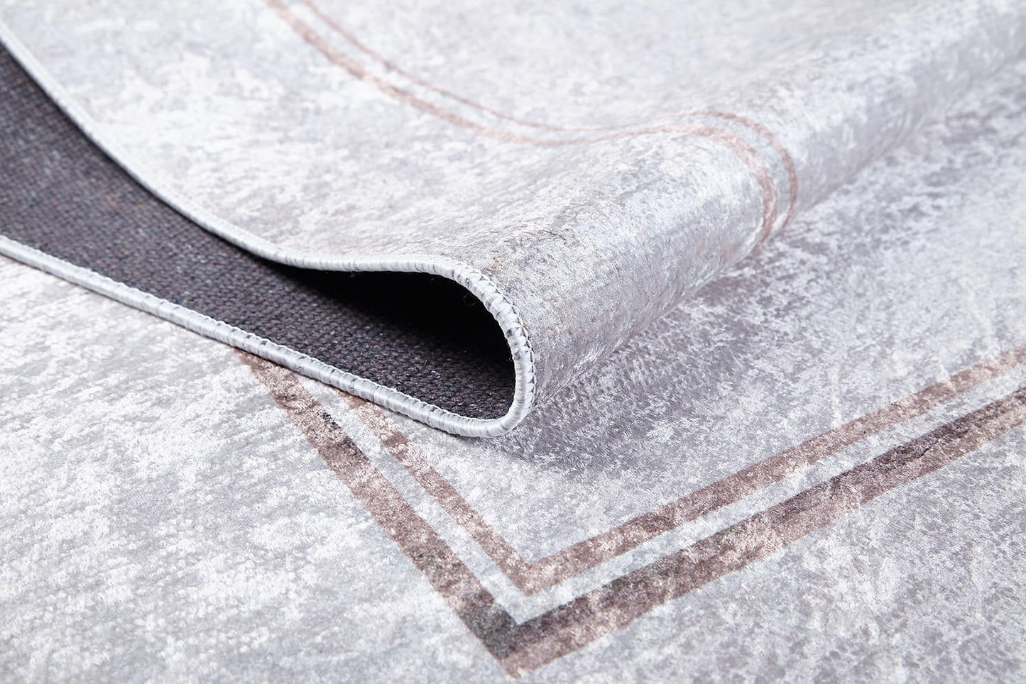 A close-up of Sophisticated Edging - Washable Rug - JR1738 (Custom Size) in light gray, featuring a brown border and dark non-slip backing—perfect for allergy-sensitive homes.