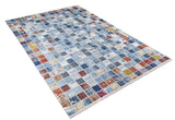 The Square Serenity - Washable Rug - JR1255 (Custom Size) features a rectangular shape with a distressed, multicolor patchwork of blue, red, yellow, white, and gray squares—perfect for high-traffic areas. Shown on a white background.