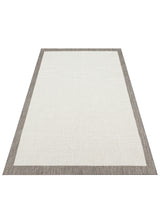 The Stone Layer - Kilim - MNO04 is a flatwoven polyester area rug with a light beige center and wide grayish-brown border in classic kilim style, displayed on a white background.