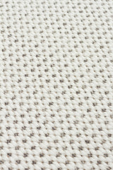 Close-up of Stone Layer - Kilim - MNO04: a white flatwoven polyester fabric with a textured, grid-like pattern from thick interlaced yarns—ideal for modern area rugs or kilim designs.