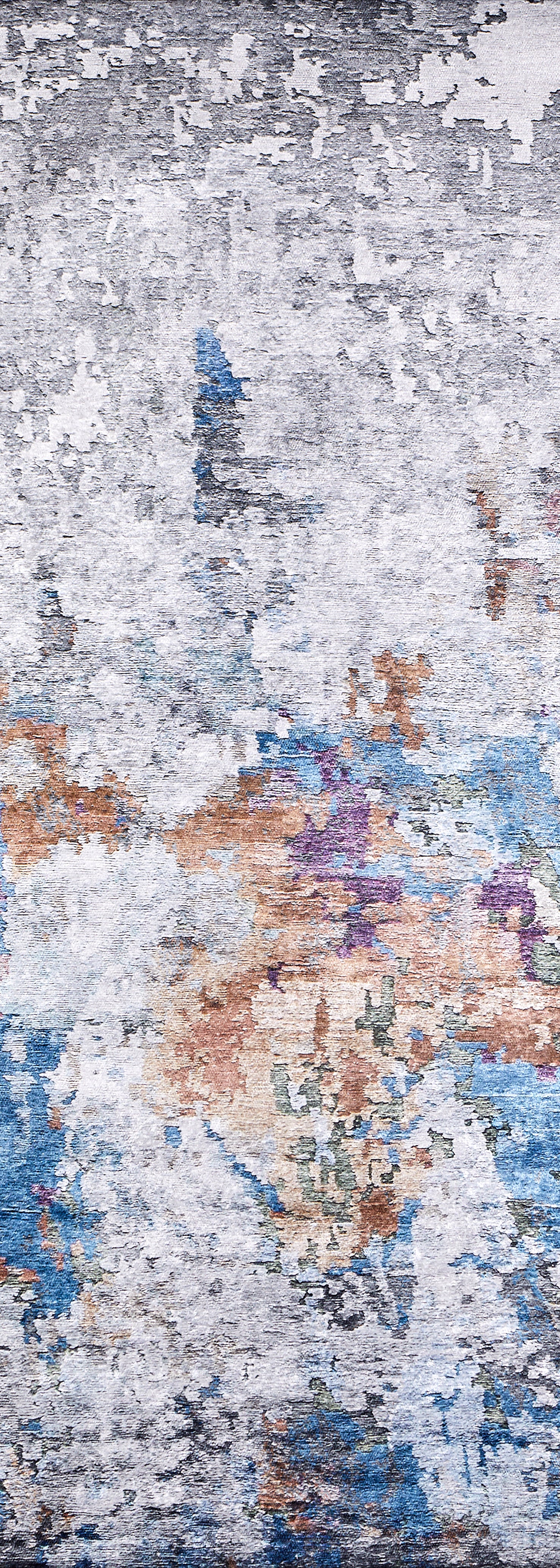 A close-up of the Striking Statements - Washable Rug - JR786 shows gray, white, blue, orange, purple, and green tones in a textured flat weave design, giving any space a modern abstract style with painterly flair.