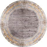 The Subtle Elegance - Washable Rug - JR1174 is a round rug with a distressed gray-brown center, faded yellow, beige, and gray borders, plus subtle corner patterns—perfect for high-traffic spaces.