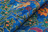 Close-up of the Summer Bouquet - Washable Rug - JR1358 (Custom Size), featuring ornate blue, orange, yellow, green, and red floral and swirl designs—perfect for high-traffic areas and easy to wash.