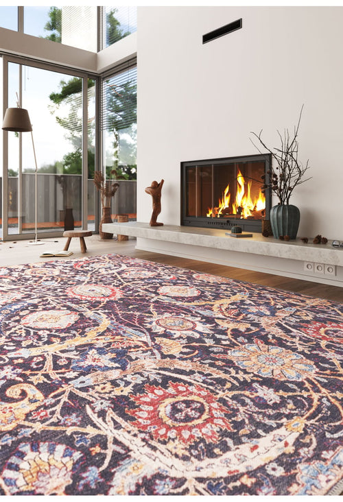 Bild 1 in Galerieansicht laden. A cozy modern living room with the Sylvanor Colorful Washable Rug - LCC3017, a bright-fire fireplace, minimalist décor, and large windows with views of trees and a patio—ideal for high-traffic spaces.
