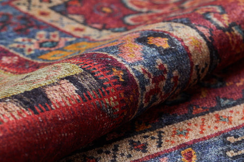 Load image 1 in gallery view. A close-up of the Tapestry Tango - Washable Rug - JR313 (Custom Size) shows its colorful geometric and floral patterns in red, blue, yellow, and cream. The woven fabric's textures are visible, making it ideal for high-traffic areas.