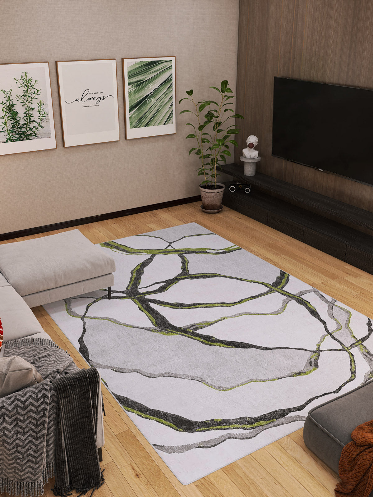 A modern living room with wooden floors, a spacious Tattered Grace - Washable Rug - JRN49 featuring green and black lines, a beige sectional sofa, a plant, a TV on a dark console, and framed art on the cream-colored wall.