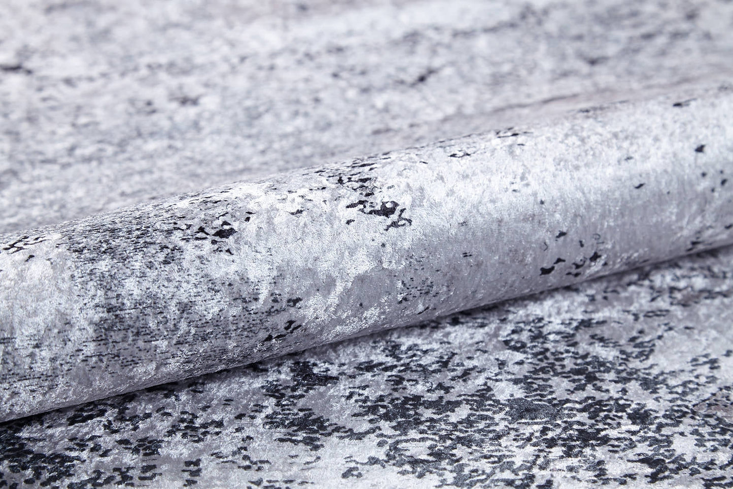 A close-up of the Techno Flux - Washable Rug - JR1814 (Custom Size), featuring a marbled silver and gray pattern—ideal for high-traffic spaces that want a sophisticated, modern touch.