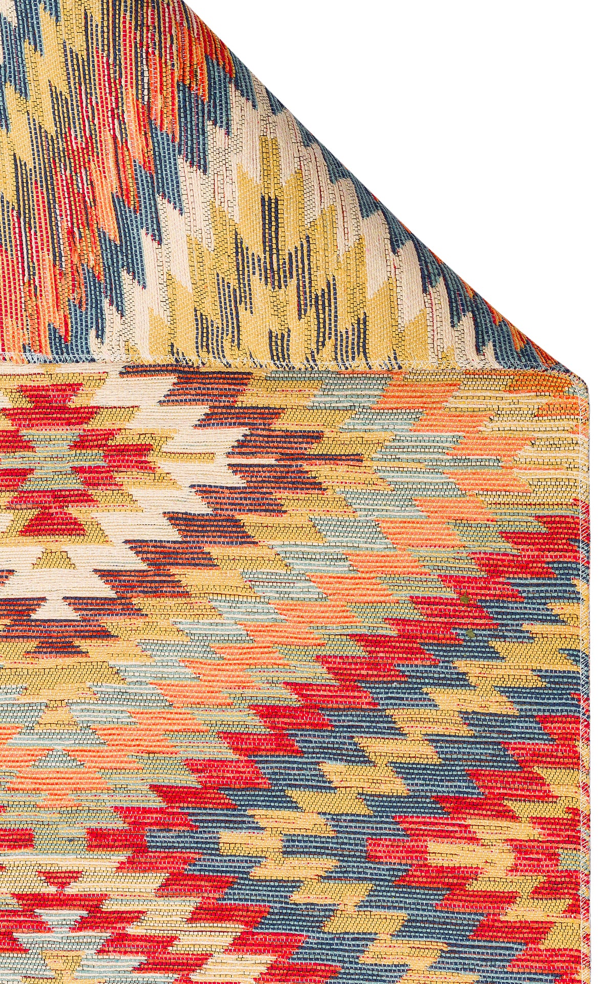 A close-up of the Terra Thread - Kilim - NMD07 rug displays vibrant zigzag patterns in red, yellow, blue, beige, and orange. One corner is folded over to show the reverse side with similar tribal designs.