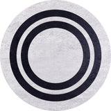 The Timeless Border - Washable Rug - JR572 features a round, light gray-anthracite design with three bold black concentric circles near the center for a minimalist geometric look. Durable and conveniently washable.