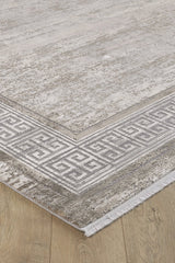 A close-up of the Timeless Remix Bordered Rug - Cream - MT189 shows its light gray Greek key pattern with a subtle texture, short fringe edges, and elegant border design, beautifully displayed on a wooden floor.