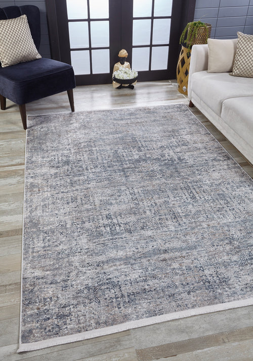 Load image 1 in gallery view. A modern living room showcases the Timeless Scrollwork - Washable Rug - JR1774 (Custom Size) in gray-anthracite on light wood floors, paired with a white sofa, dark armchair, and vase near glass-paneled double doors—ideal for high-traffic areas.