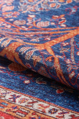 A close-up of the Tree of Plenty Red Blue Washable Rug (LCC3031, Custom Size) showcases its vibrant floral and geometric patterns in blue, orange, and red—perfect for high-traffic spaces and easy to clean.