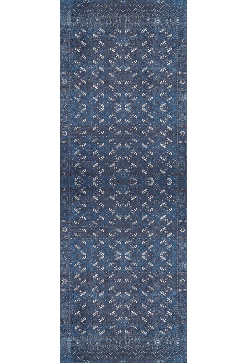 The Tribal Trail - Washable Rug - JR1939 is a rectangular blue rug with an intricate symmetrical pattern of white and light blue floral motifs, plus detailed borders—ideal for adding traditional elegance to high-traffic spaces.