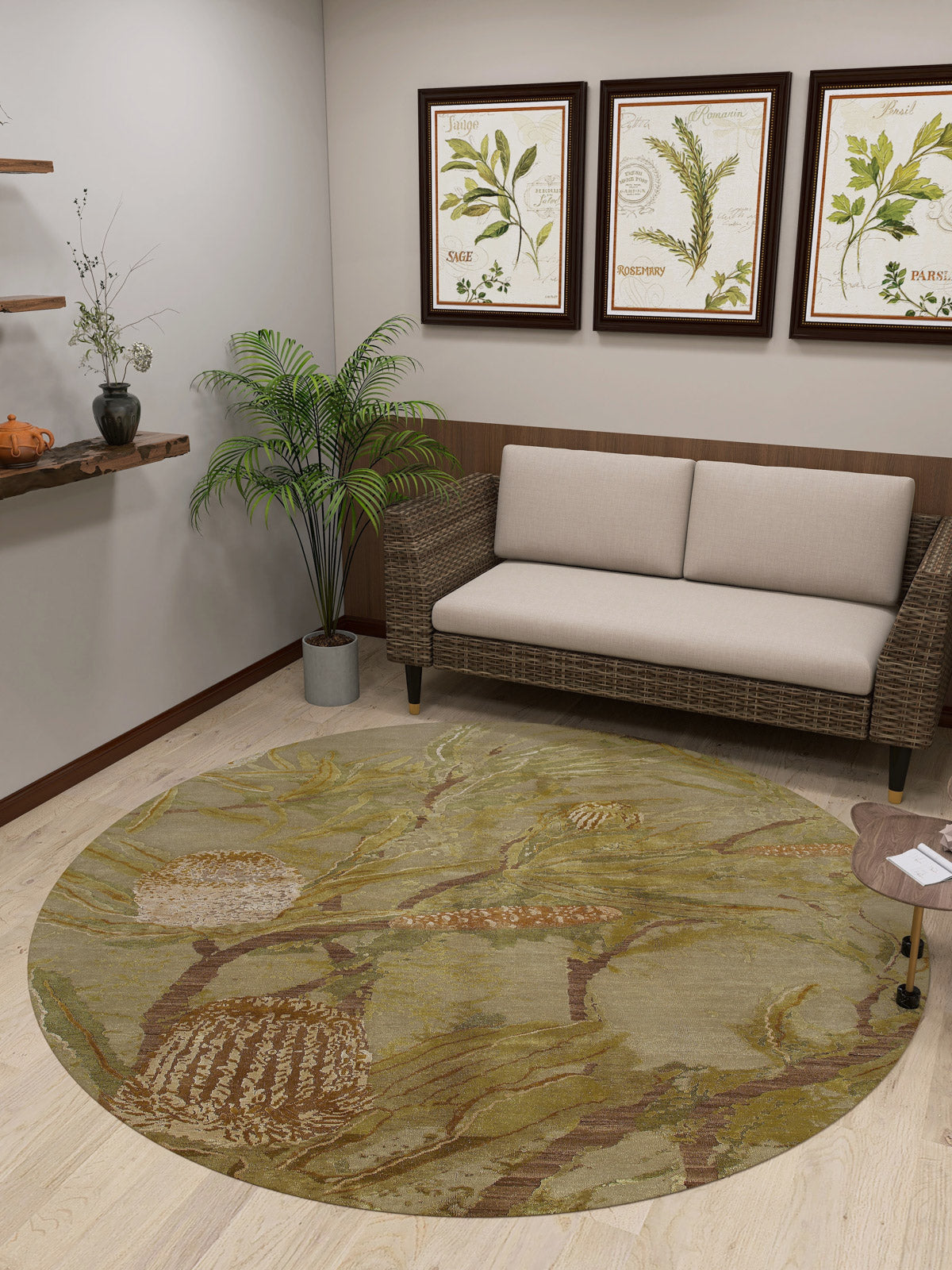 A cozy room with a wicker sofa, beige cushions, the Dreamweaver's Loom Washable Rug - JRS001 (Custom Size) in green—ideal for high-traffic areas—a small table, potted plant, botanical wall art, and a wooden shelf with decor items.