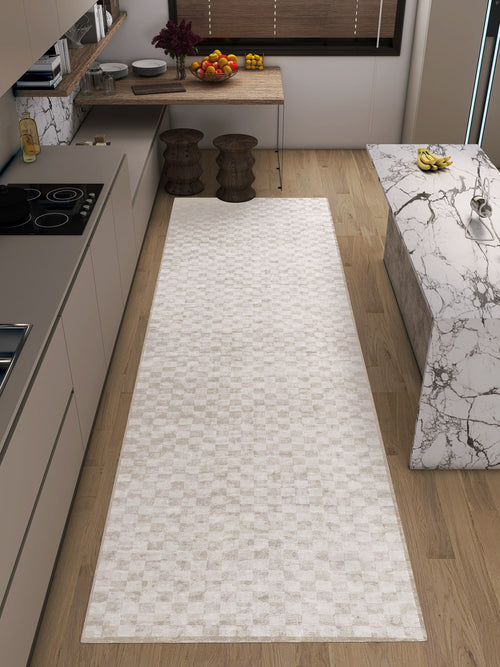 Load image 1 in gallery view. A modern kitchen with light wood flooring, neutral tones, a long Opulent Threads - Washable Rug - JRN27 ideal for high-traffic areas, beige cabinets, a marble island, and a table with fruit bowls and two wooden stools.
