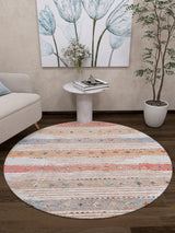 The Nomad's Nostalgia - Washable Rug - JR1669 (Custom Size) adds vibrant color and striped style to dark wood floors, complementing a light sofa, round table, potted plant, and floral painting—ideal for high-traffic spaces.
