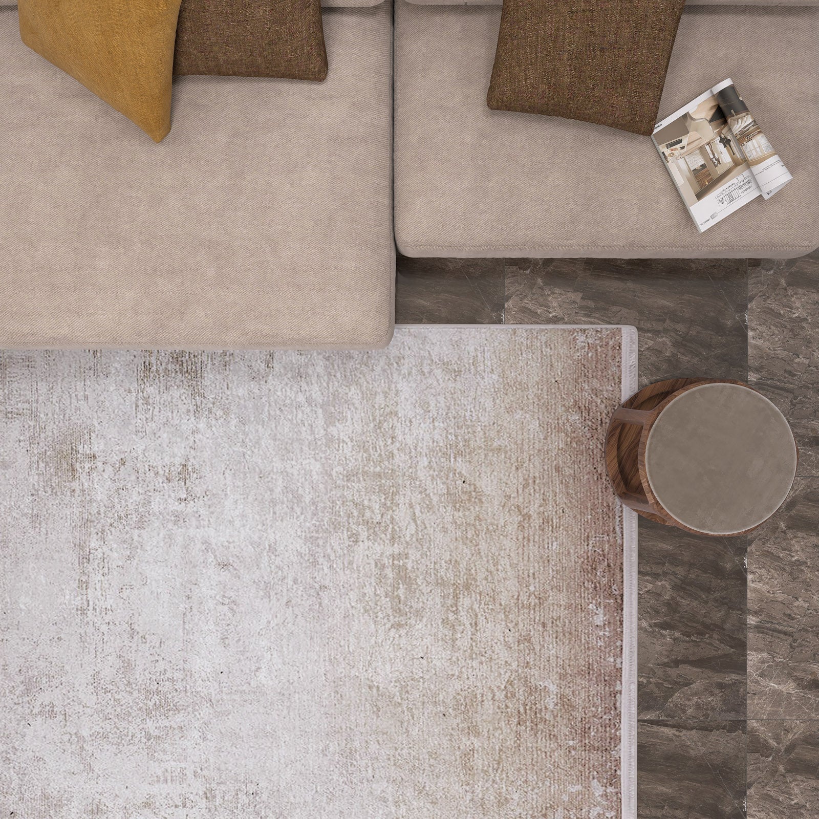 A top-down view of a beige sectional sofa with brown and yellow cushions, a magazine, a round wooden side table, and the Cinnamon Swirl - Washable Rug - JR425 (Custom Size) over dark tiled flooring.