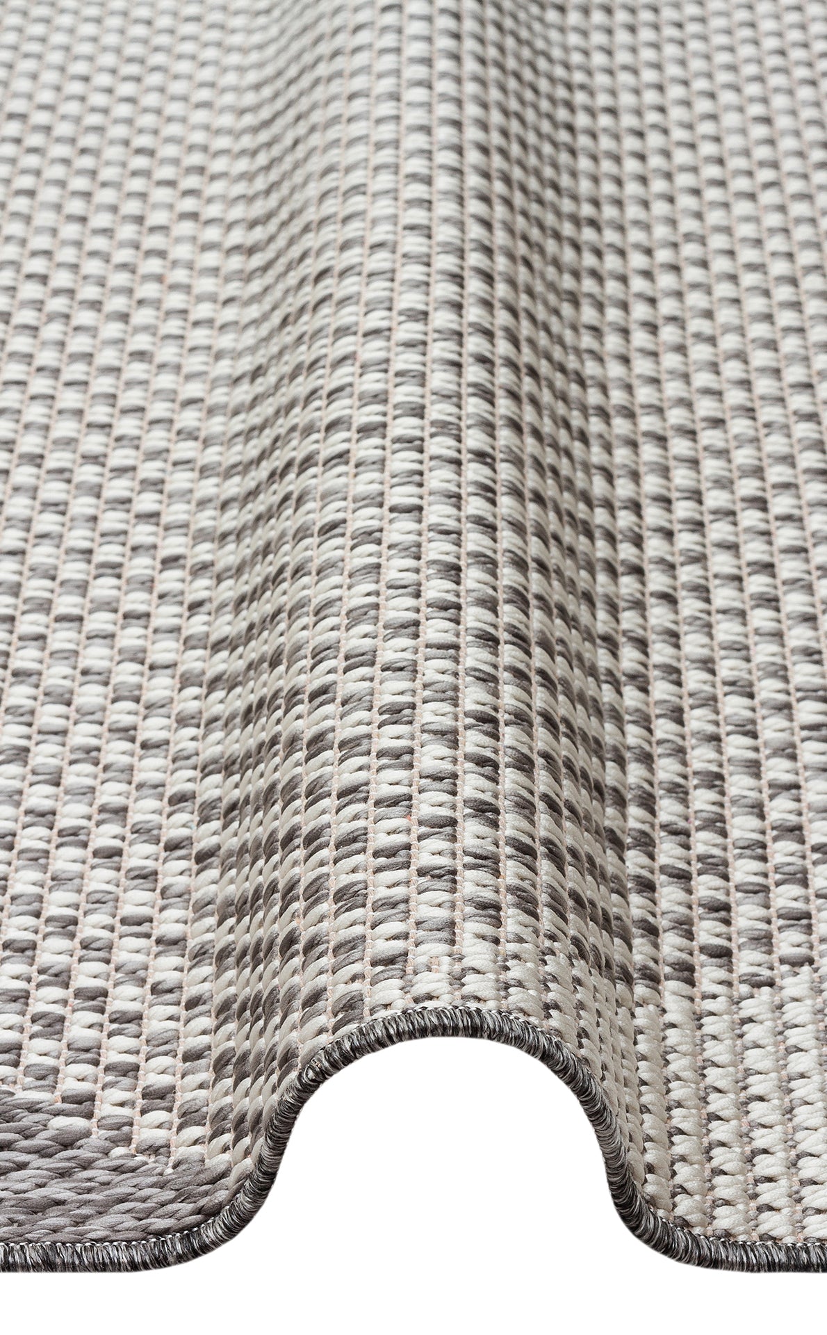 A close-up of the Urban Thread - Kilim - MNO03 rug shows its flatwoven polyester texture and wavy fold, featuring a grid-like pattern in beige and gray with visible edge stitching for a modern touch.