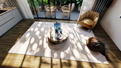 Load image 1 in gallery view. A modern living room with a round coffee table, blue vases, a book, armchair, pouf, and large windows opening to a patio. Sunlight casts leaf shadows on the Vanilla Dream Modern Bordered Rug - EW2742 and the floor.