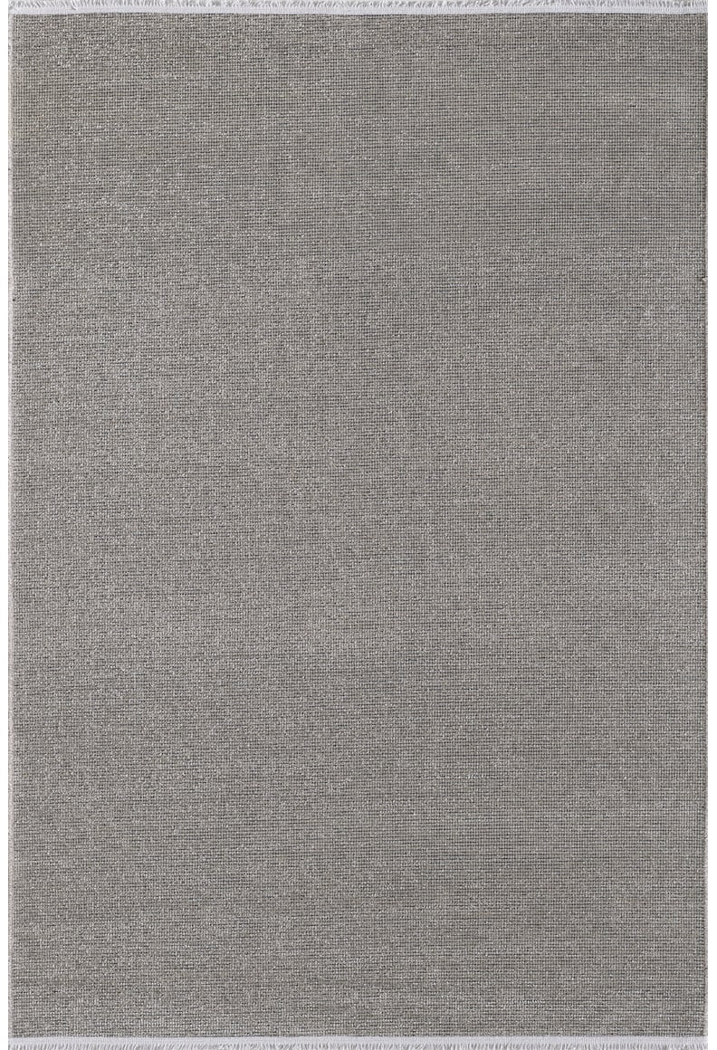 The Velvet Touch Gray Area Rug - PST003 features a rectangular shape, subtle solid texture, thin lighter border, and minimalist modern design. Its flat, evenly woven surface provides a stylishly understated look for any space.