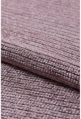 Close-up of the Velvet Touch Pink Area Rug - PST004 reveals a textured, woven mauve fabric with a rolled edge and grid pattern—ideal for adding soft-touch elegance to any contemporary space.