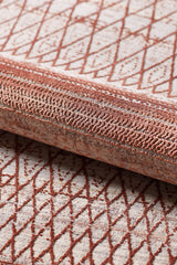 A close-up of the Vibrant Bohemian Trellis Rug - HRD009 shows its intricate rust red geometric and lattice pattern on a light beige viscose-polyester background, highlighting the woven material’s texture.