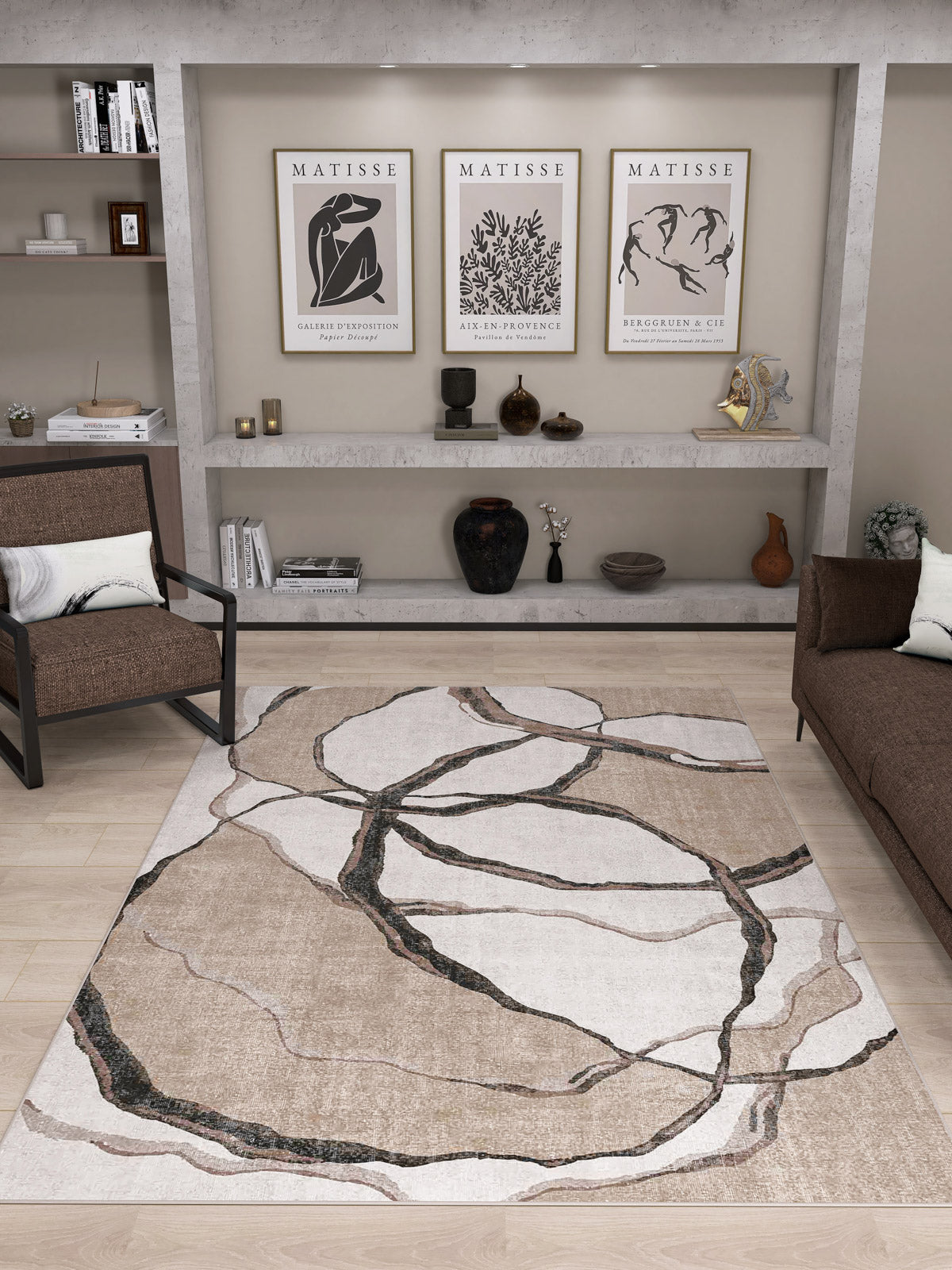 A modern living room featuring the Vintage Muse - Washable Rug - JRN47 (Custom Size) with an abstract pattern, brown sofas, decorative vases, bookshelves, and three Matisse art prints above a built-in shelf.