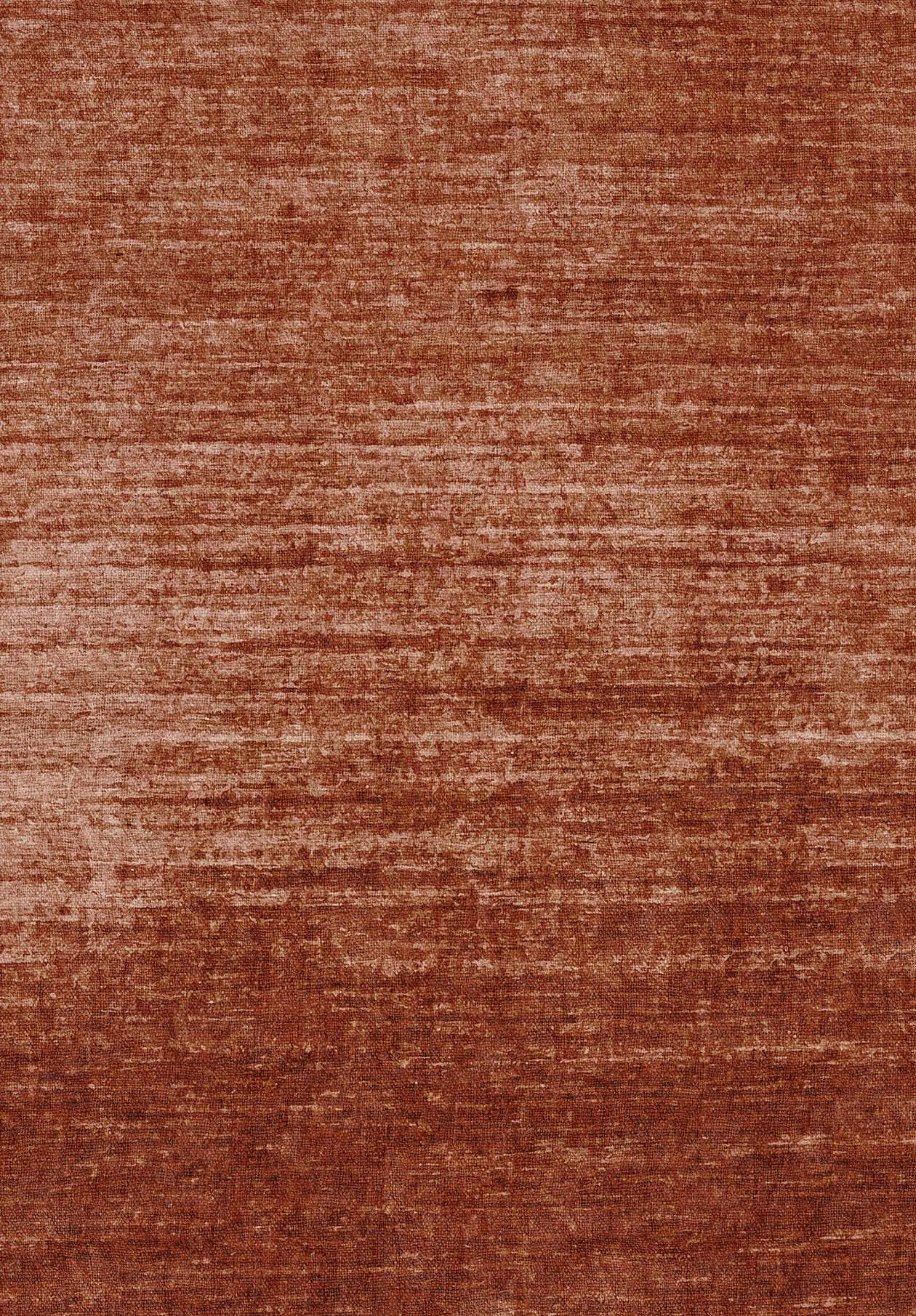 A close-up of the Vintage Reverie - Washable Rug - JRN31 reveals its textured, reddish-brown fabric with deep red hues and subtle horizontal lines for a soft, velvety, ombre-inspired look.