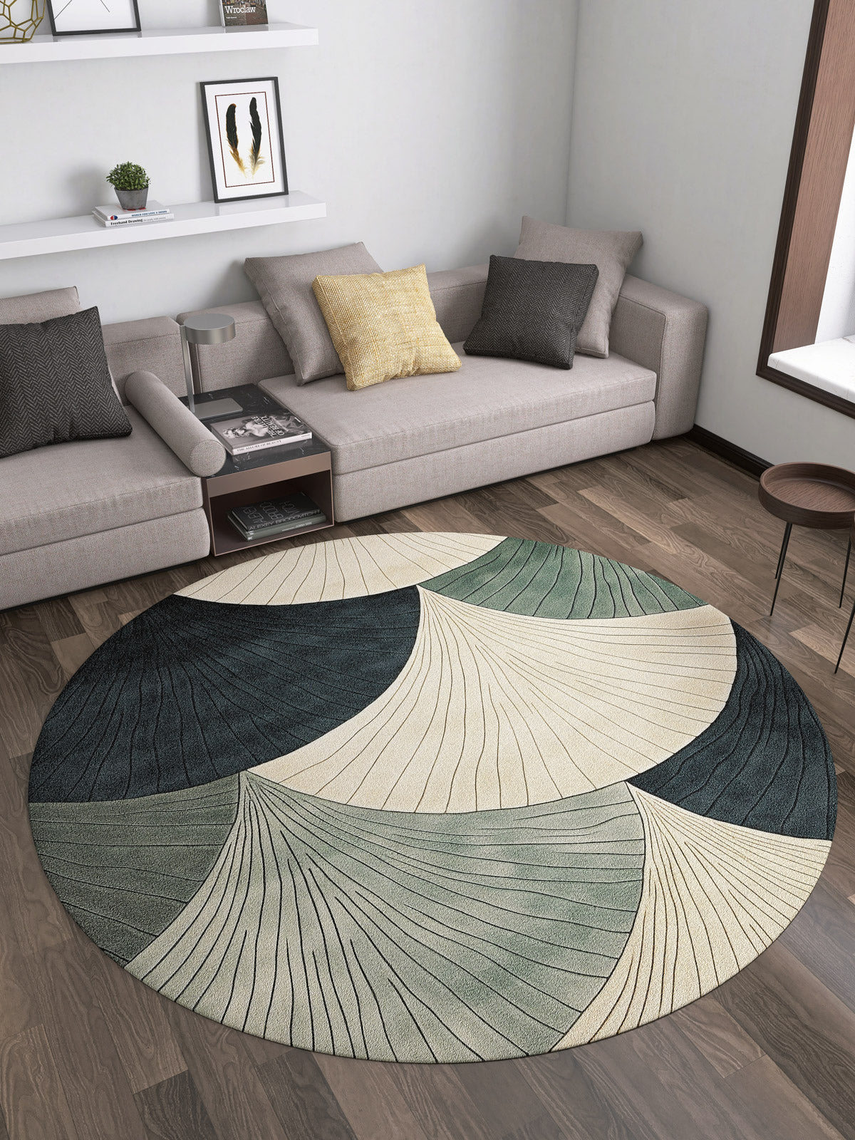 A modern living room with two gray sofas, accent pillows, a small wooden side table, and the Vivian Modern Washable Area Rug - MDJ010 featuring abstract leaf patterns in cream, green, and dark blue—ideal for allergy-prone or high-traffic wood floors.