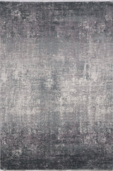 The Vortexia Silver Premium Rug - M472A is a rectangular, machine-made rug featuring a distressed abstract pattern in gray, white, and muted purple for a textured, vintage look.