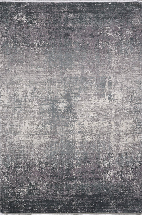 Load image 1 in gallery view. The Vortexia Silver Premium Rug - M472A is a rectangular, machine-made rug featuring a distressed abstract pattern in gray, white, and muted purple for a textured, vintage look.