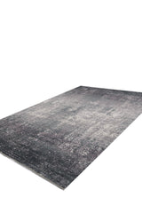 The Vortexia Silver Premium Rug - M472A features a rectangular, contemporary design with a distressed texture in shades of gray, black, and white, displayed on a white background.