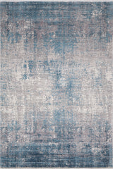 The Vortexia Sky Premium Rug - M472B is a rectangular machine-made rug with an abstract, distressed pattern in blue, gray, and white for a modern textured look.