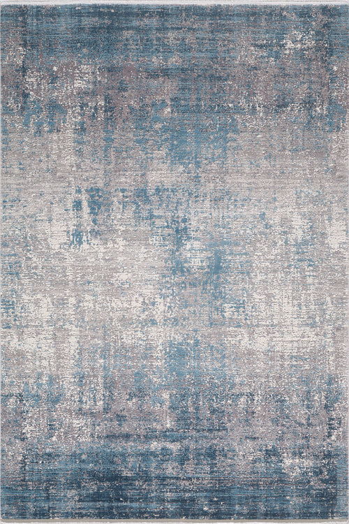 Load image 1 in gallery view. The Vortexia Sky Premium Rug - M472B is a rectangular machine-made rug with an abstract, distressed pattern in blue, gray, and white for a modern textured look.
