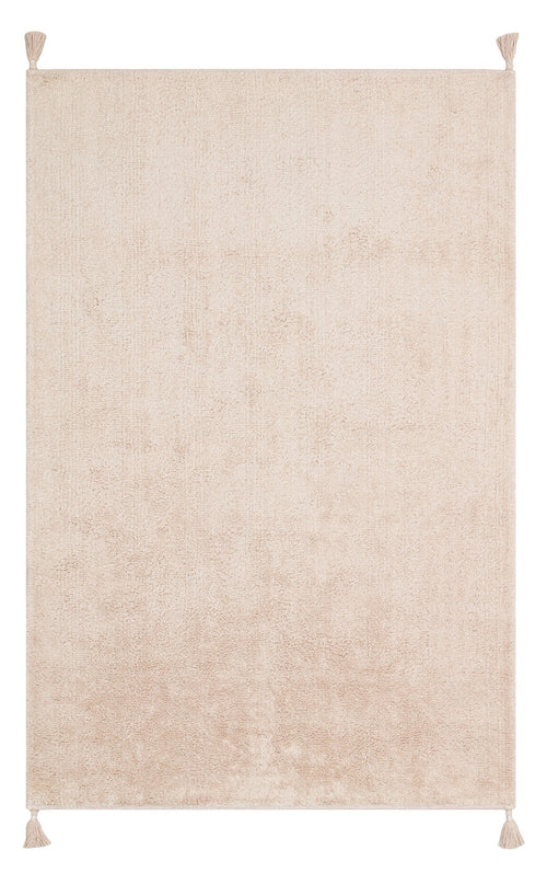 Load image 1 in gallery view. The Warm Sand - Washable Shaggy - CBNPLAIN is a rectangular, cream beige cotton rug with a soft, textured surface and small tassels at each corner for a simple, cozy touch.