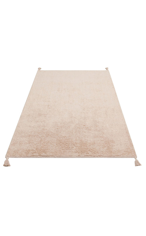 Load image 1 in gallery view. The Warm Sand - Washable Shaggy - CBNPLAIN is a rectangular cream beige cotton shag rug with a soft texture and small tassels at each corner, shown on a white background.