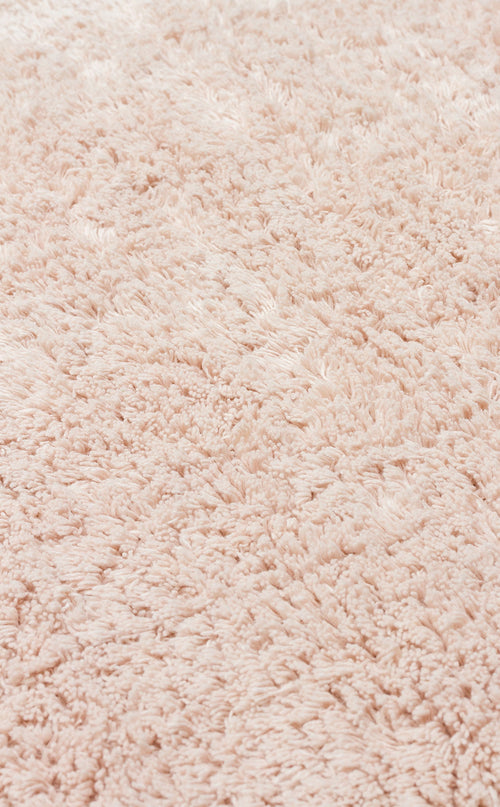 Load image 1 in gallery view. Close-up of the Warm Sand - Washable Shaggy (CBNPLAIN) rug, featuring a soft, fluffy cream beige surface with textured shaggy fibers.