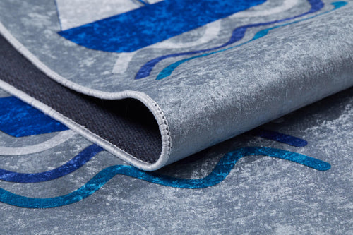 Load image 1 in gallery view. A close-up of the WaveVenture - Machine-Washable Rug JRC087 (Custom Size) shows its grey and blue wavy pattern, thickness, and texture—perfect as a washable rug for high-traffic areas.