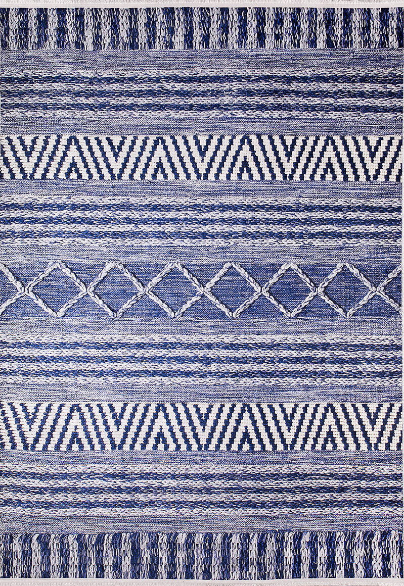 The Wavy Wonders - Washable Rug - JR941 (Custom Size) features blue and white geometric patterns—stripes, zigzags, and diamonds—symmetrically arranged on a rectangular surface. Ideal for high-traffic areas and easy to clean.